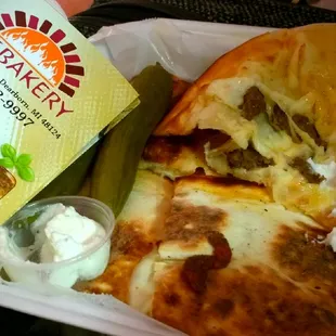 Folded Slices of Sojuk n Cheese long only 5 bucks got pickles n Toum delicious  Love  very best