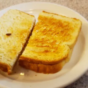 two slices of toasted bread on a plate