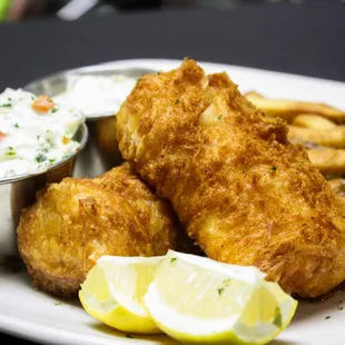 A Wisconsin Supper Club tradition--Fish n&apos; Chips! Beer battered cod loins, house cut fries, coleslaw, tartar, and fresh lemon.