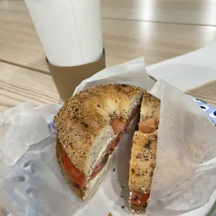 Lox bagel on everything bagel with red onion, capers, tomato and cream cheese