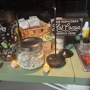 Hot cocoa with marshmallows and hot coffee along with hot churros and ice cream