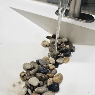 rocks in bathroom sink