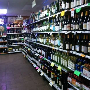 rows of bottles of wine in a store