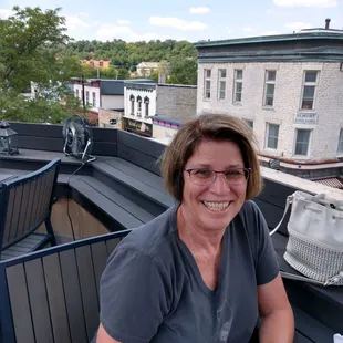 a woman sitting on a balcony