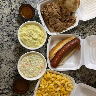 Pulled pork, smoked sausage, Mac and cheese, potato salad, coleslaw and hot bbq sauce.
