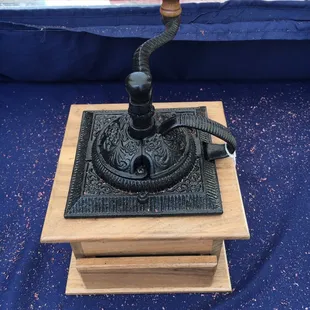 an antique coffee grinder
