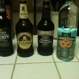 My haul: Belhaven Scottish Stout, Banana Bread Beer, Young&apos;s Double Chocolate Stout, and Glazed Donut flavored 460 Vodka