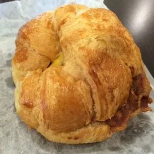 HUGE bacon egg and cheese croissant sandwich.