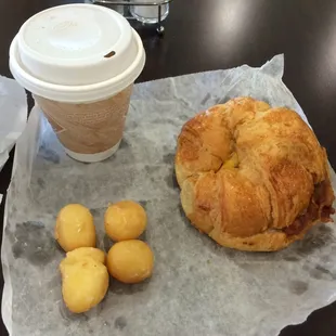 a croissant, coffee and potatoes