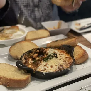 a plate of food and bread