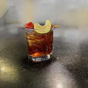 a drink with a lime slice on the rim