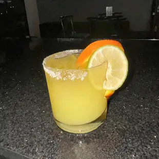 a margarita with a slice of orange