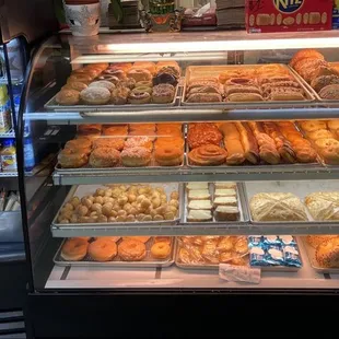 a display case filled with various types of donuts