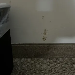 Not sure but maybe food on the wall