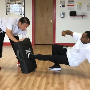 John helping Jimmie on his ground defense.