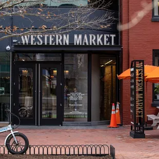 a bicycle parked in front of a store