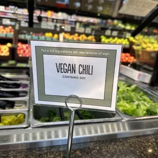 a sign that says vegan chili