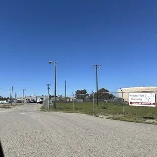 Street sign + gated entrance