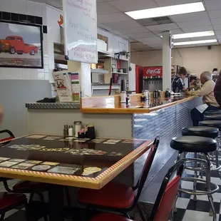 Deceiving outside appearance, cute diner interior.