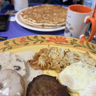 Country breakfast with hash Browns and a huge pancake