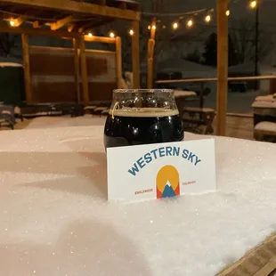 a glass of beer on a table