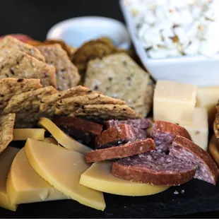 a platter of cheese and crackers