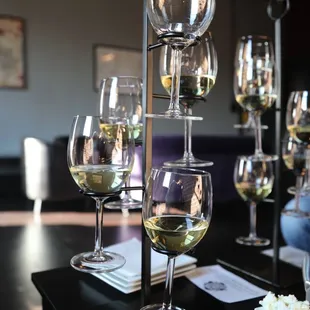 several glasses of wine on a table