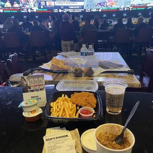 TV wall, "Chicken wings" actually tenders, garbage ass chili and fries.