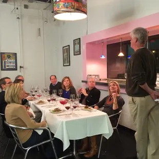 a group of people sitting around a table