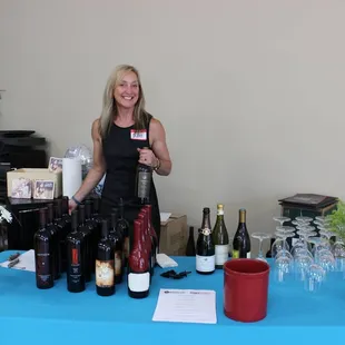 a woman holding a glass of wine