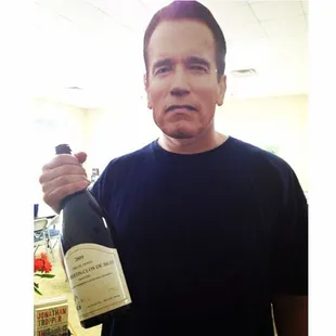 a man holding a bottle of wine