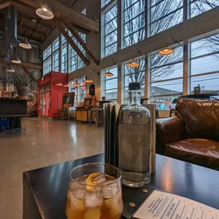 a glass of whiskey and a bottle of whiskey on a table