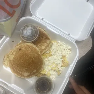 Pancakes with eggs.... That's cheddar cheese sprinkled on top &amp; it was suppose to be scrambled with the eggs but.....
