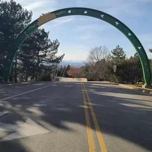 Entrance view of the Arch (I walked to the middle of the road to take this pic) ... you can see the Rockies in the background  02-24-2024
