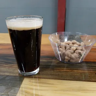 a pint of beer and peanuts