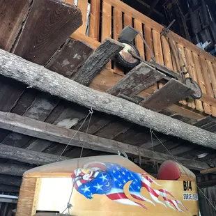 an old wooden boat with an american flag painted on it