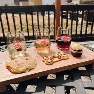 a wine glass, cupcakes, and cupcakes