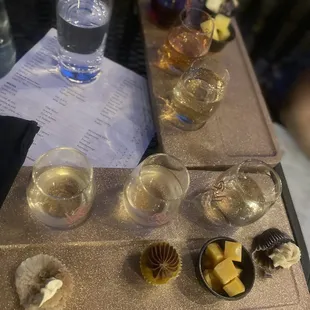 One flight with cheese and one with cupcakes