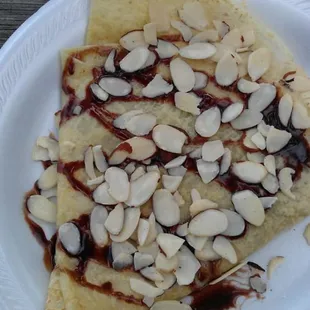 a slice of pizza on a paper plate