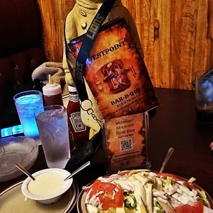 a plate of salad and a sandwich