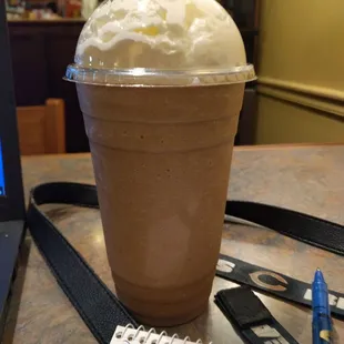 a chocolate milkshake with whipped cream