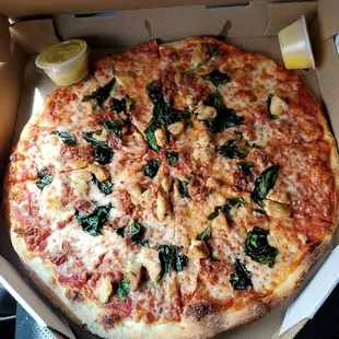 Pizza with chicken, bacon, spinach,  plus side of garlic sauce