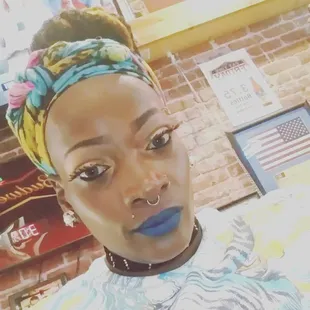 a woman with blue lipstick