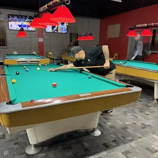 two men playing pool