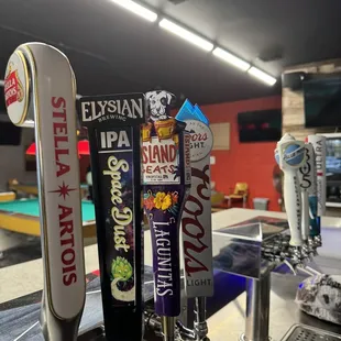 a row of beer taps