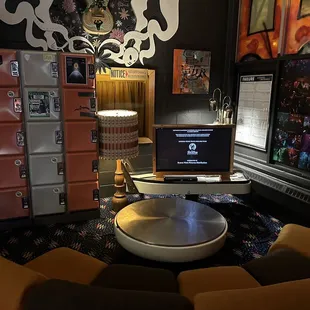 a coffee table with a laptop on it