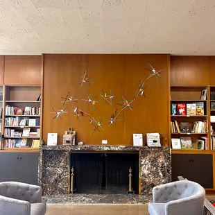 Our lovely fireplace complete with a bookstore and some fine glass artwork