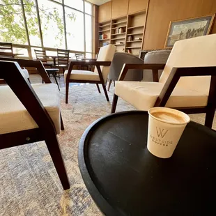 a coffee cup on a table in a waiting room
