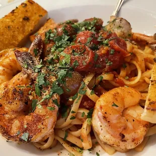 a plate of pasta and shrimp