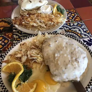 Breakfast of champions-chicken fried steak and a breakfast burrito.